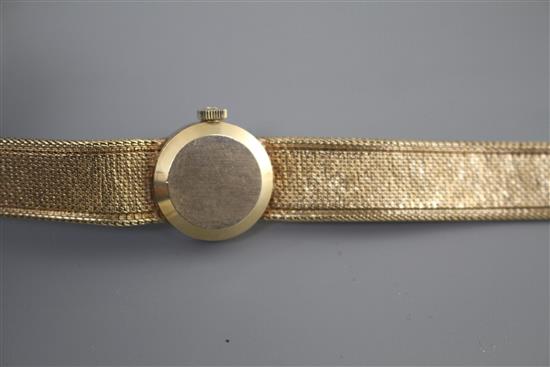 A ladys 1960s? 9ct gold Omega manual wind wristwatch, on integral textured 9ct gold Omega bracelet, gross weight 23.2 grams.